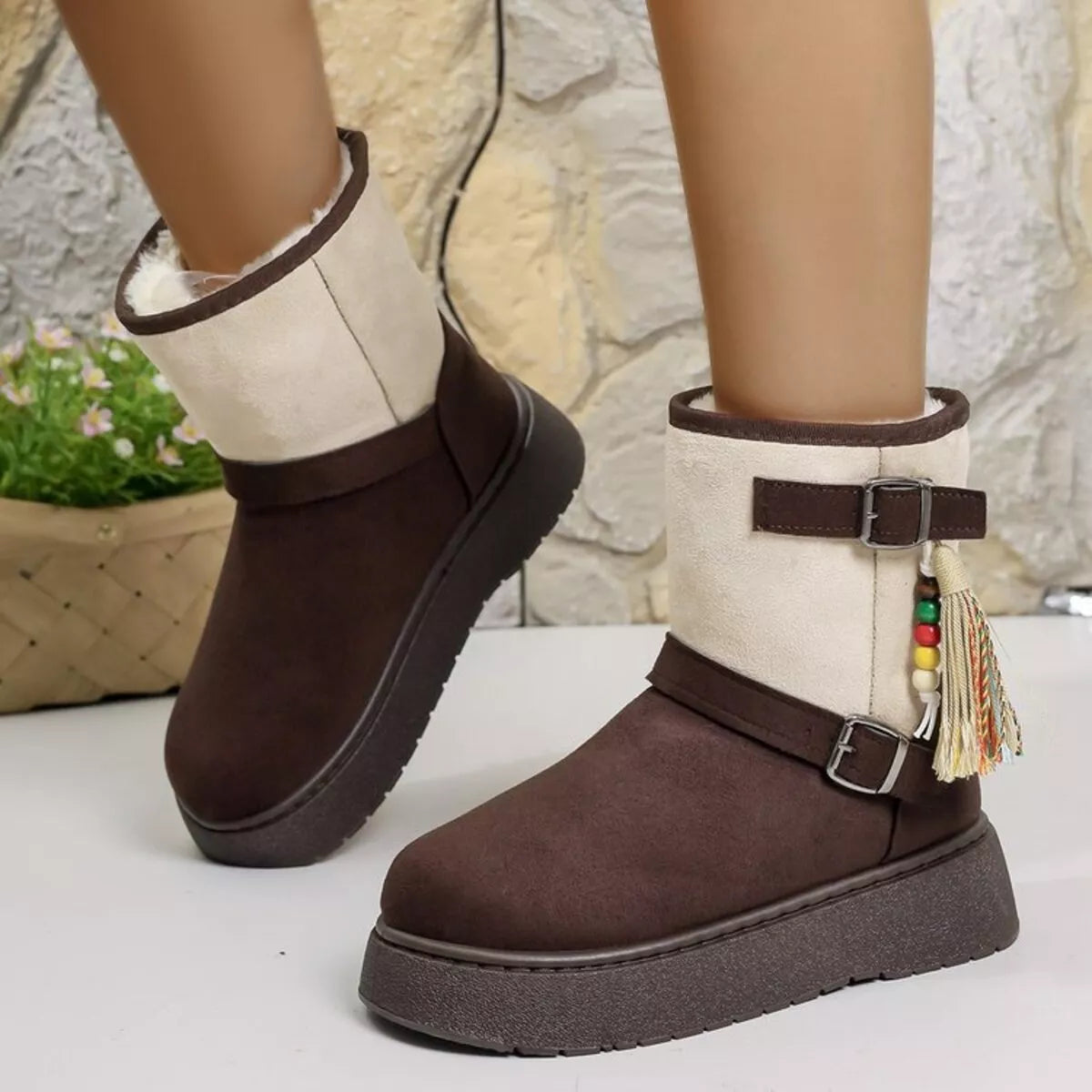 Brown ankle boots with white panels, buckle strap, tassel trim, chunky outsole