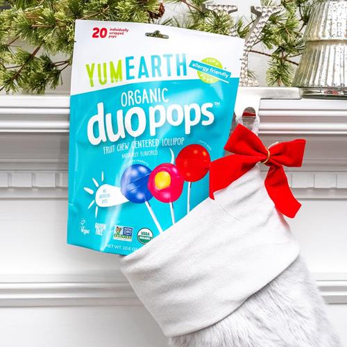 Organic duo pops candy bag with red ribbon on a white stocking