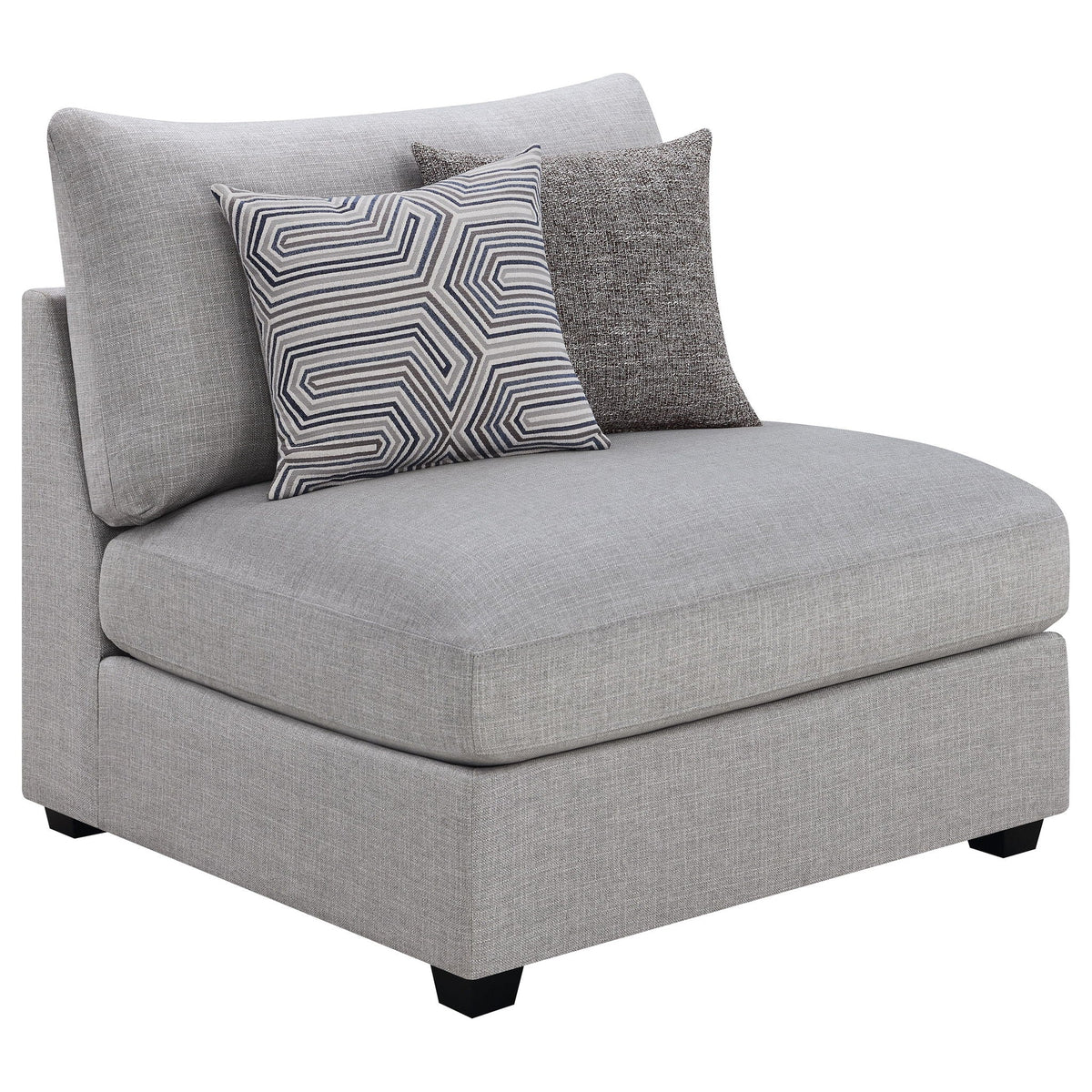 Grey upholstered chaise sectional with geometric patterned and solid pillows