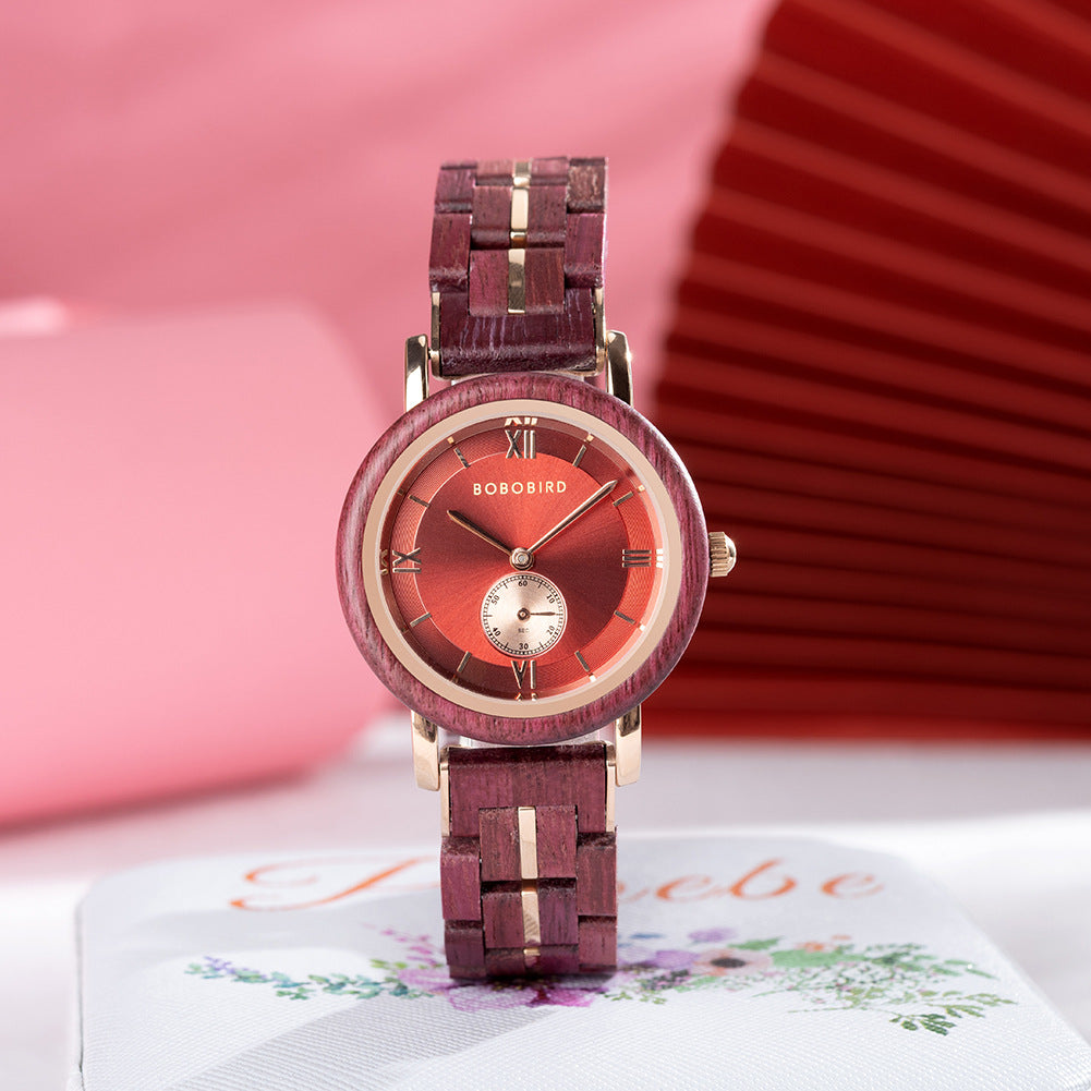 Burgundy wooden quartz watch with red dial, Roman numerals, and wood link strap