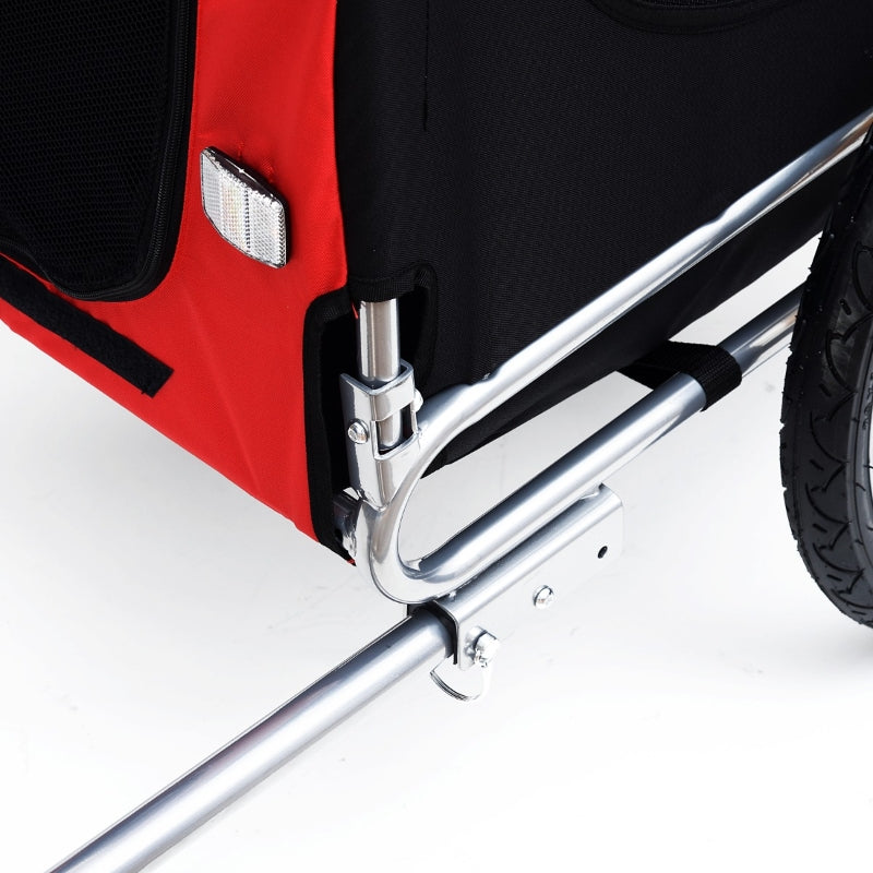 Pet trailer frame connection with silver metal bars and red outer fabric side pocket