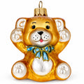 Golden bear glass Christmas ornament with blue bow and raised paws, hanging loop.