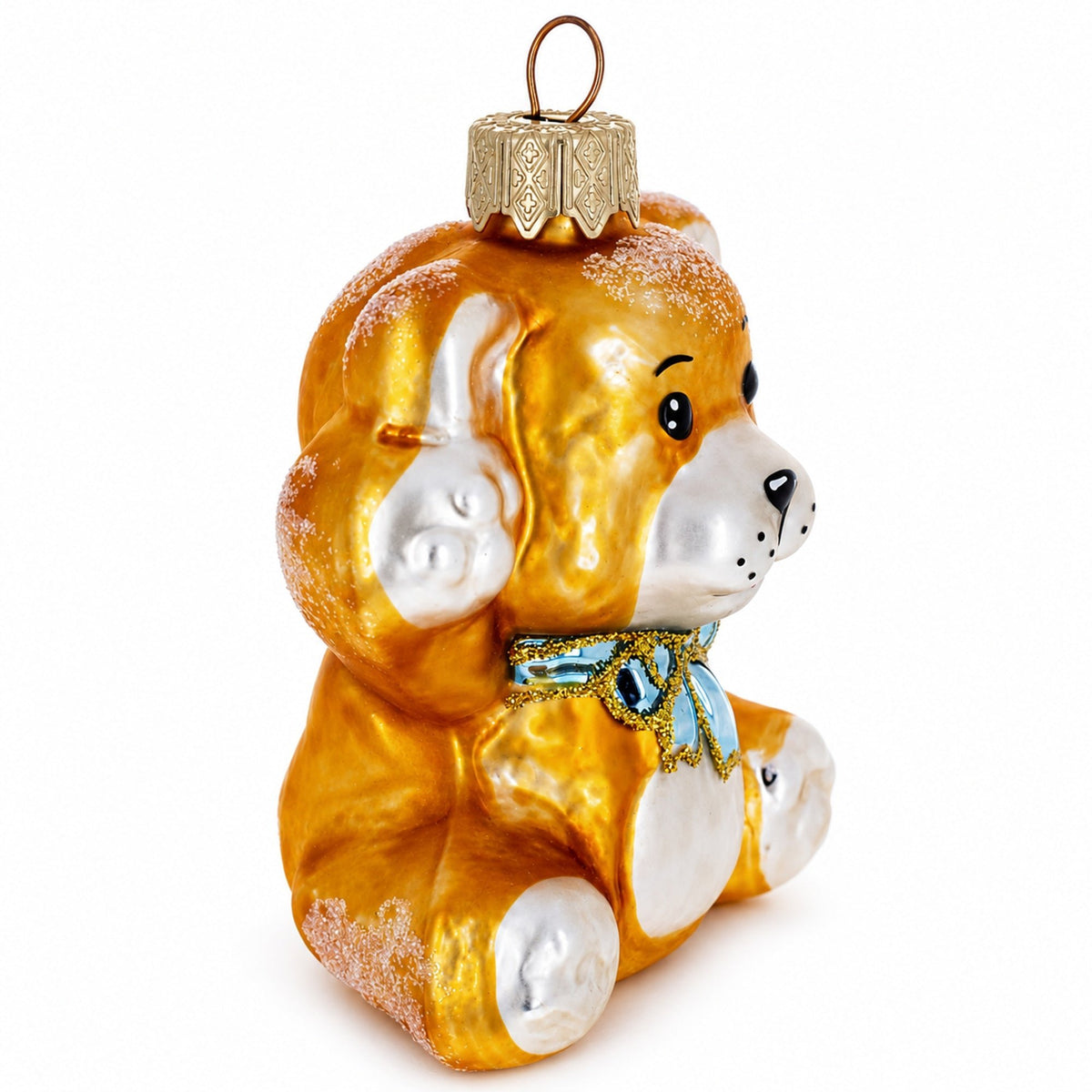Gold bear glass ornament with blue ribbon bow, paws forward, and hanging loop.