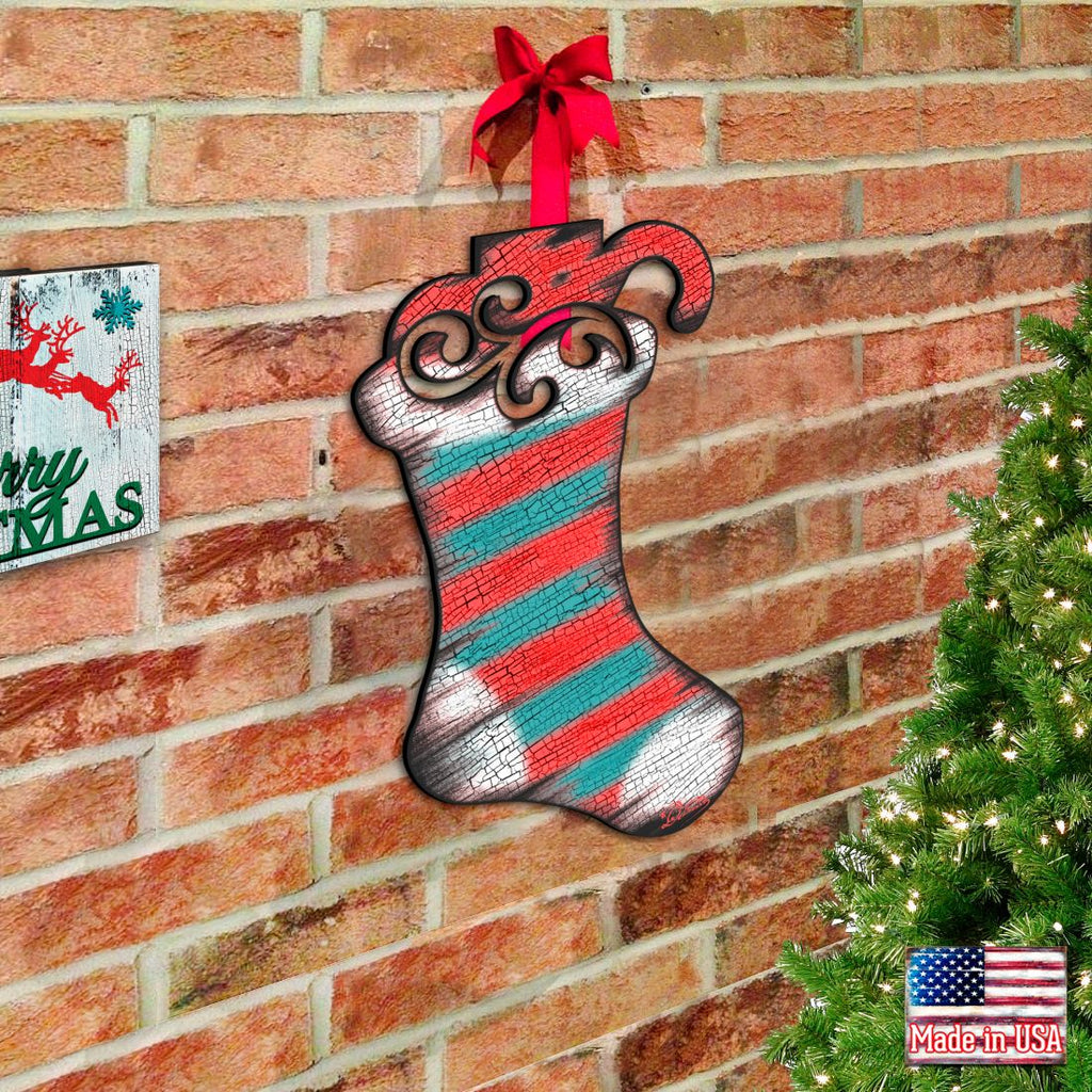 Hanging Christmas stocking door decor with red, teal, and silver striped textured finish
