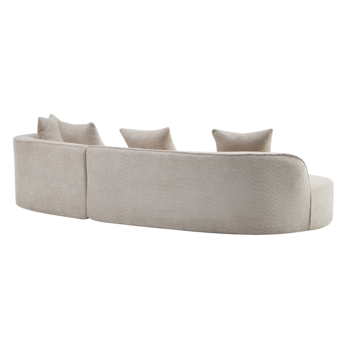 Light beige curved sectional sofa side view with three back cushions and pillows