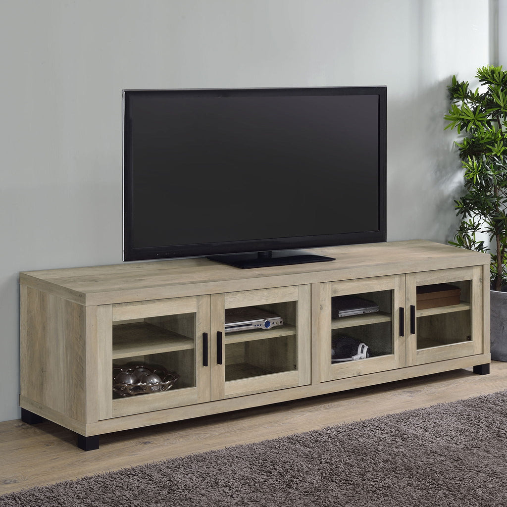 Distressed pine TV stand with four doors and open shelves, on black legs