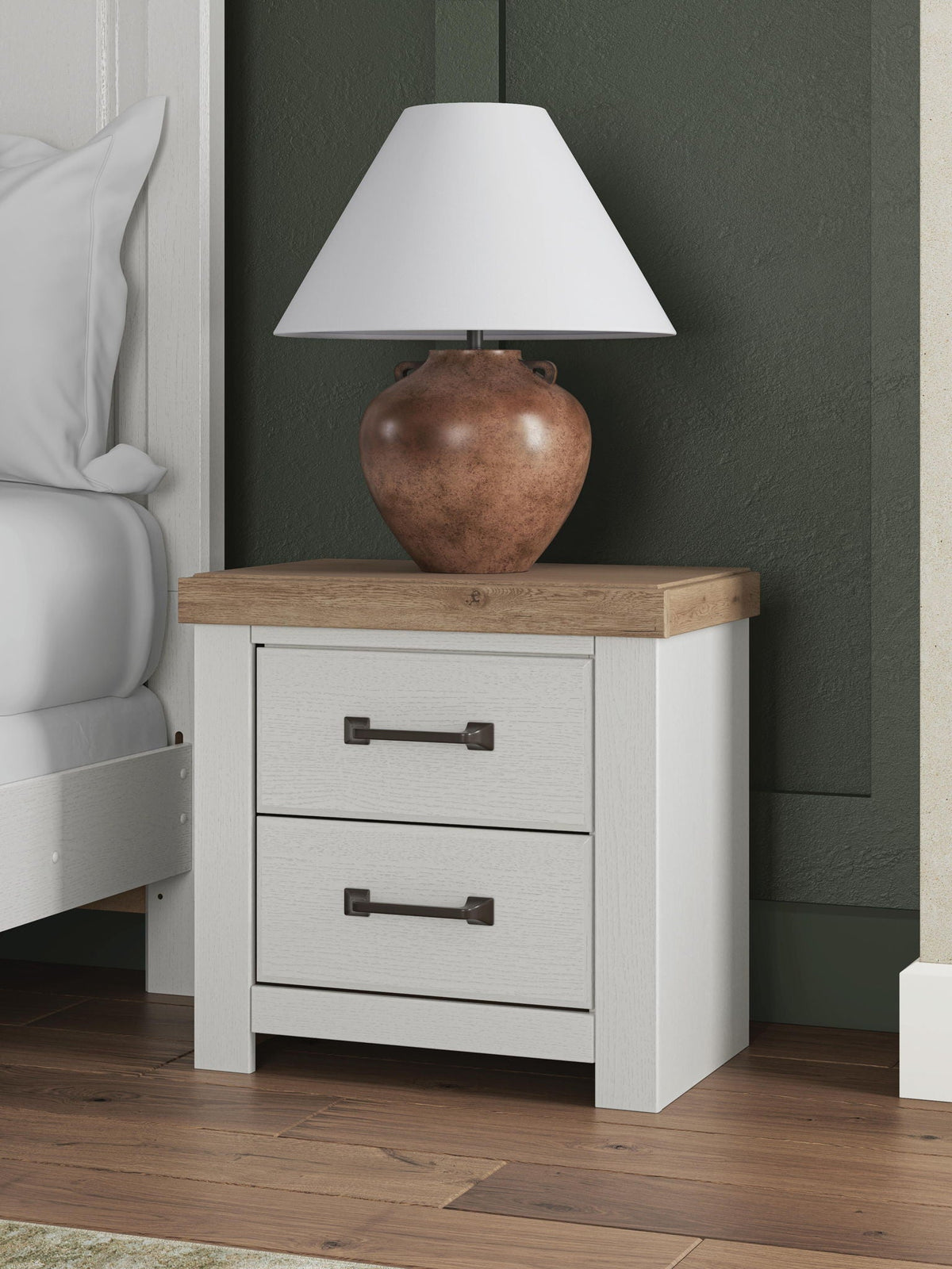 White two-drawer nightstand with brown top and metal bar pulls