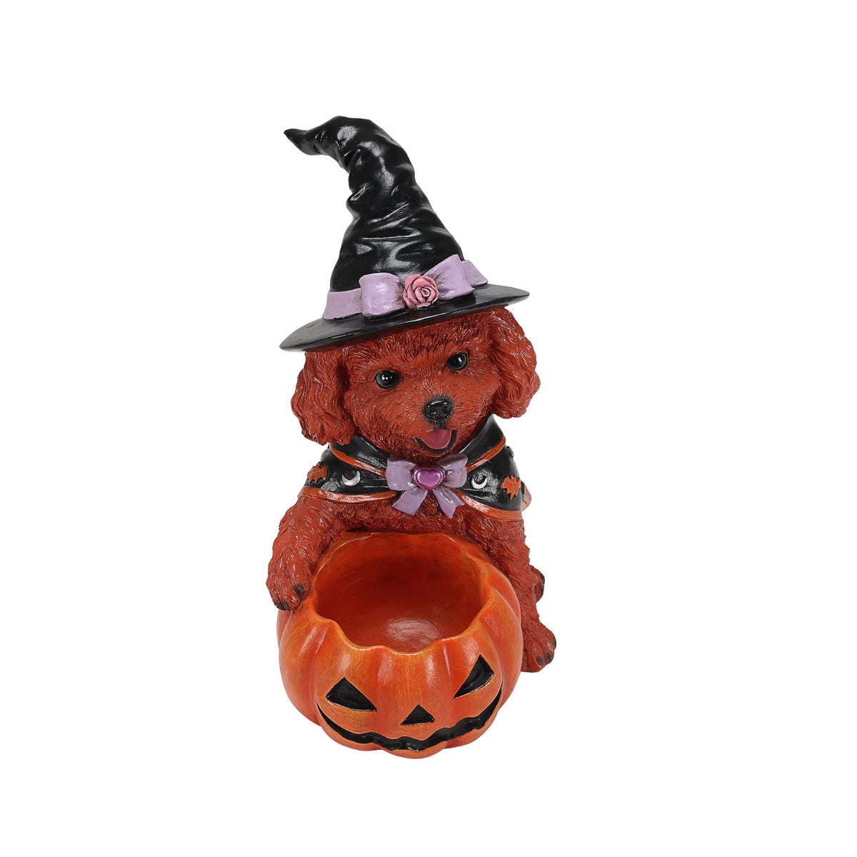 Top view of a dog witch figurine and the open pumpkin candy bowl