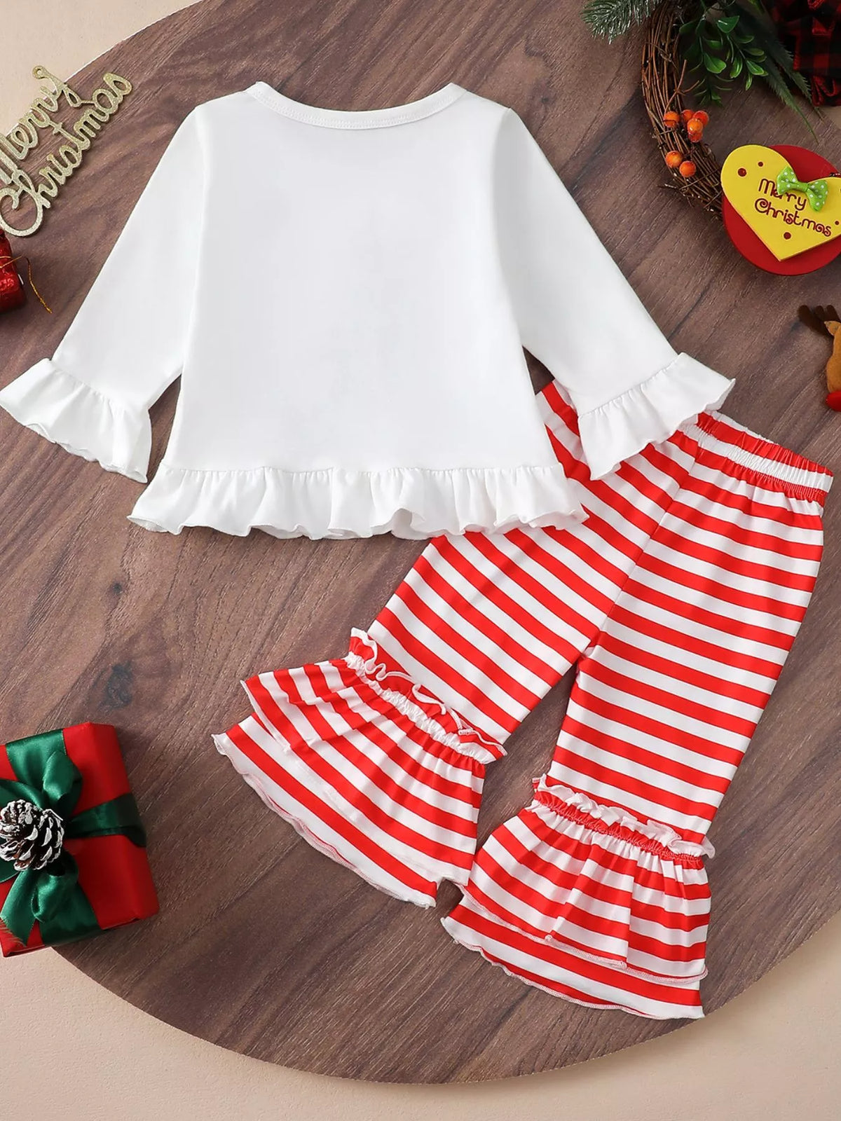 White Christmas ruffle-hem top with long sleeves and red-and-white striped flare pants