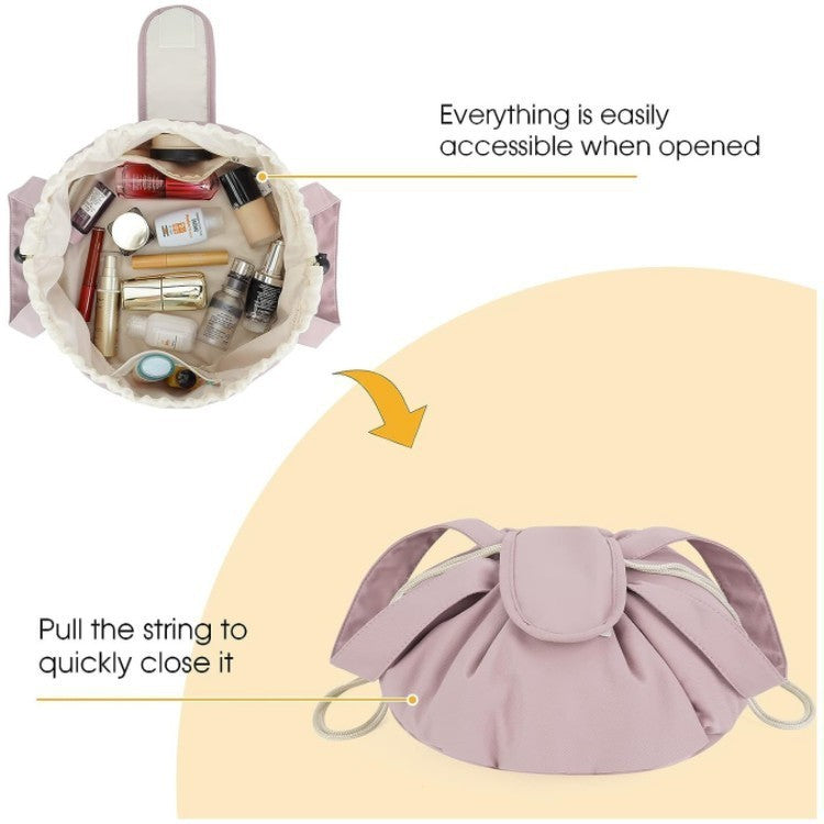 Lavender barrel drawstring makeup bag open, showing cosmetics and toiletries inside