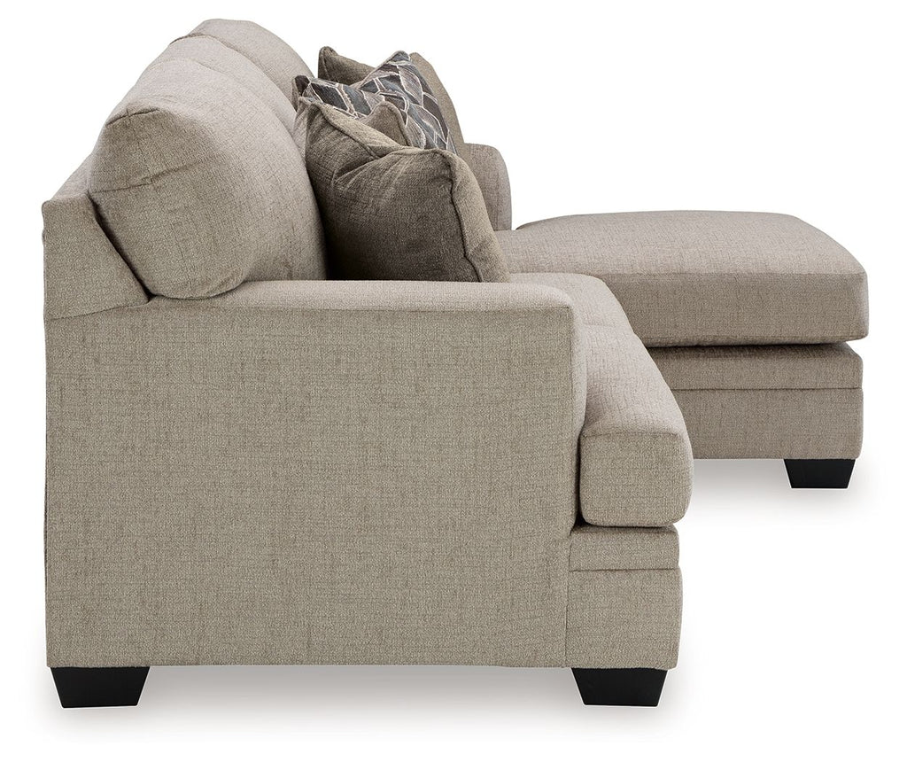 Upholstered sectional sofa with chaise, light beige fabric and black block feet
