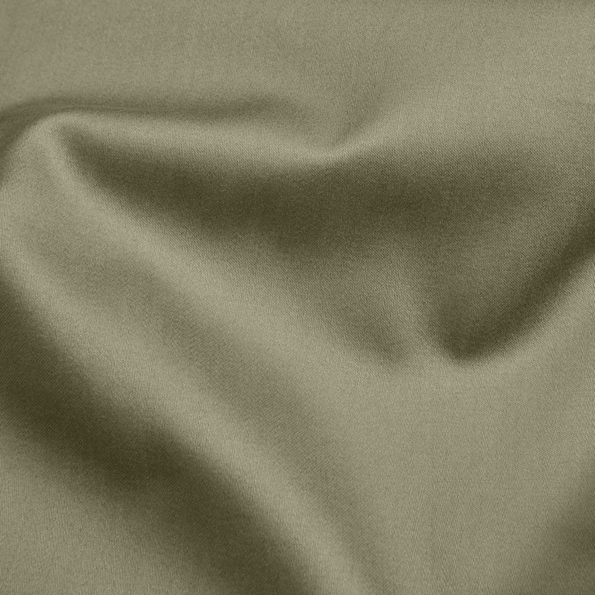 Olive green sateen fabric sheet surface with smooth satin-like sheen