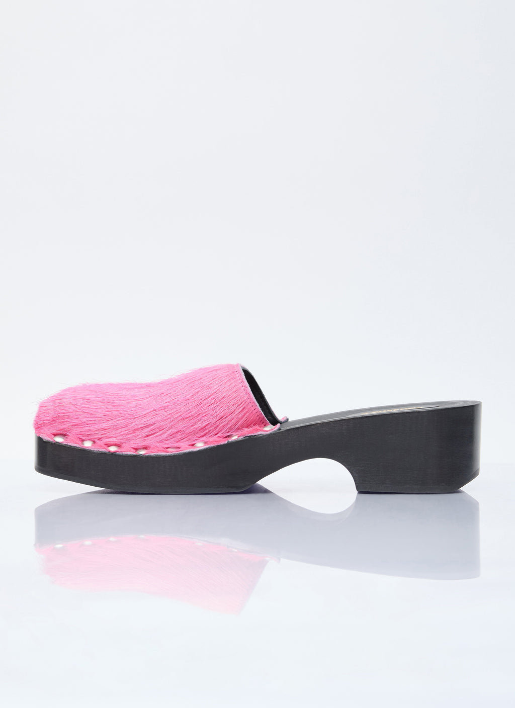 Pink furry clogs with wide black platform heel and open back