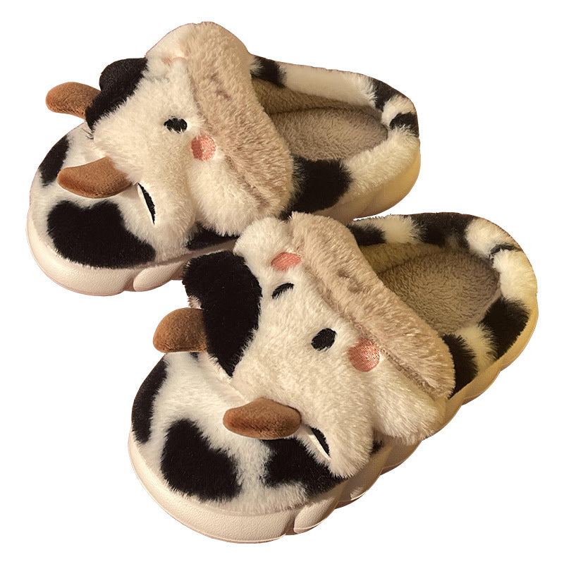 Coffee-colored plush cow slippers with tan-and-black spots, brown ear accents, soft slide style