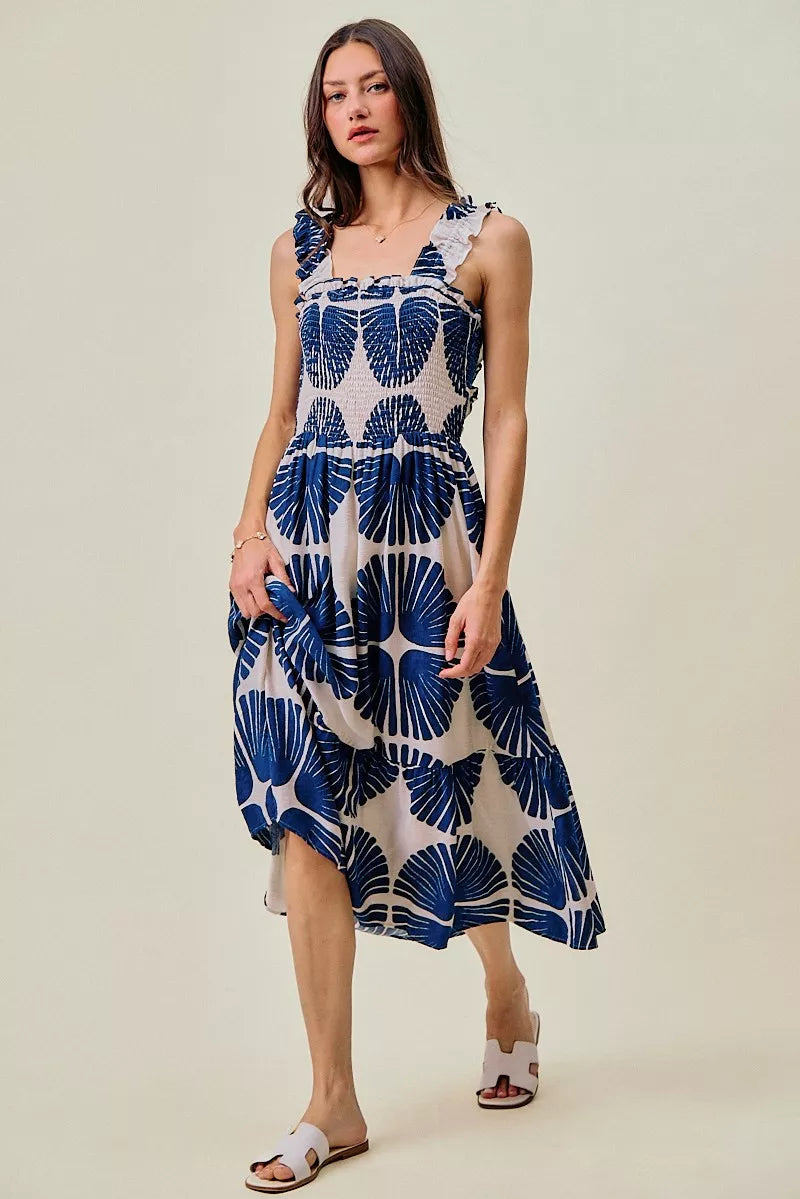 Navy and white abstract print midi dress with smocked bodice and tiered skirt