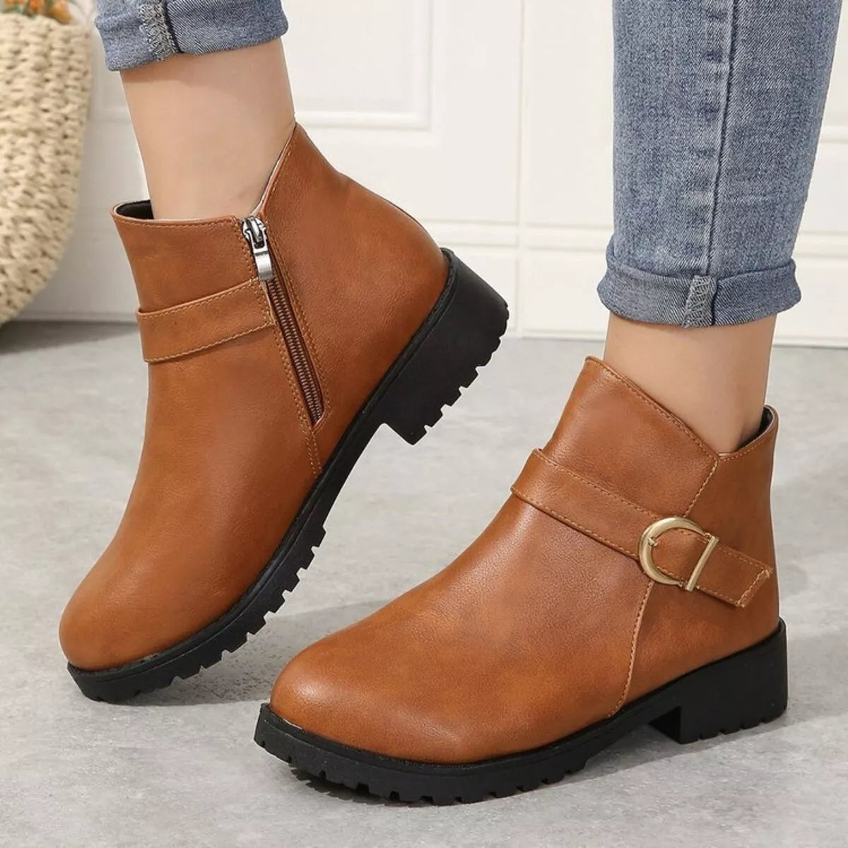 Caramel ankle boots with side zipper and gold buckle strap, chunky lug sole