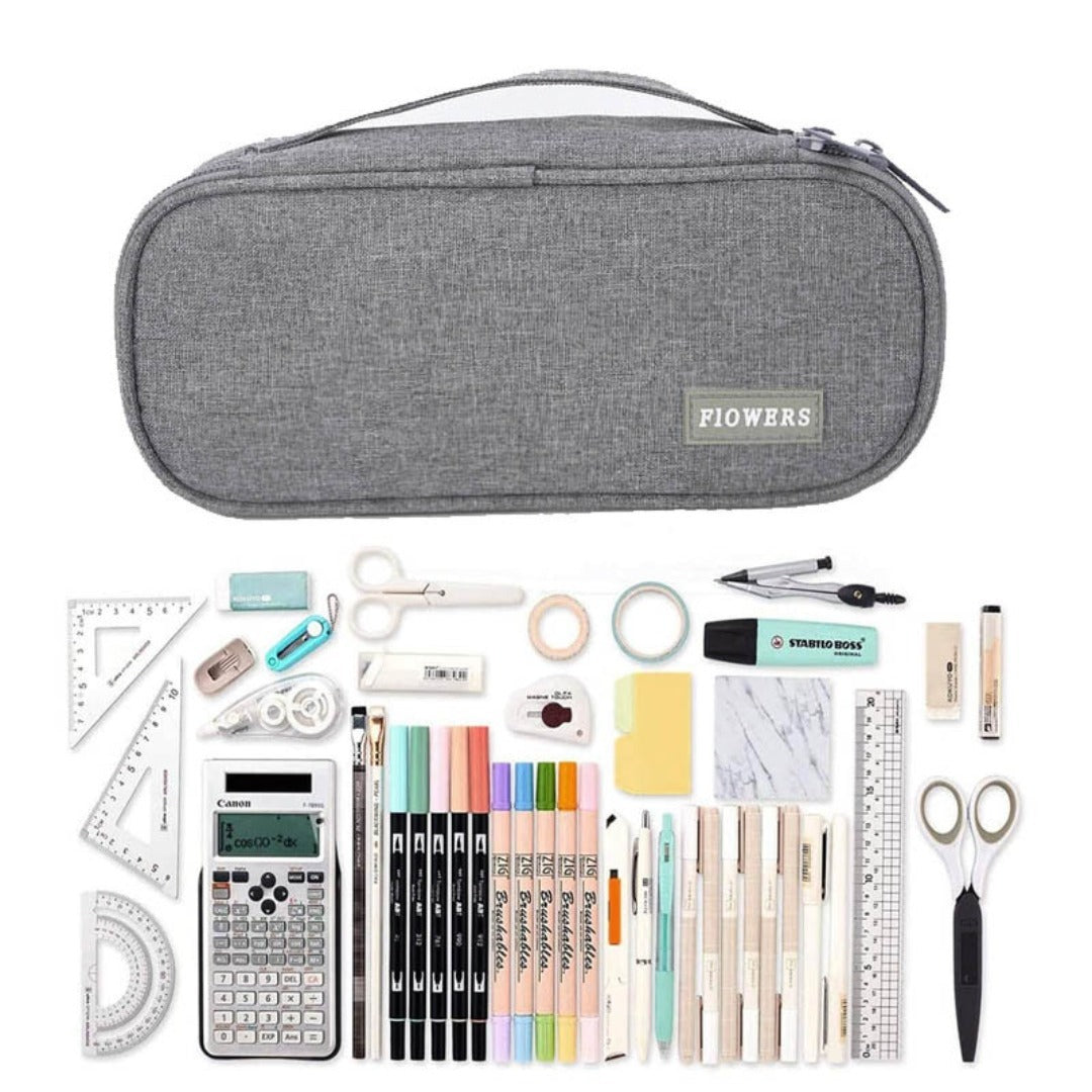 Grey fabric zipper pencil case with front brand patch, shown closed