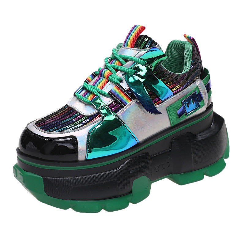 Green lace-up chunky sneaker with shiny silver toe, rainbow lace trim, and black sole