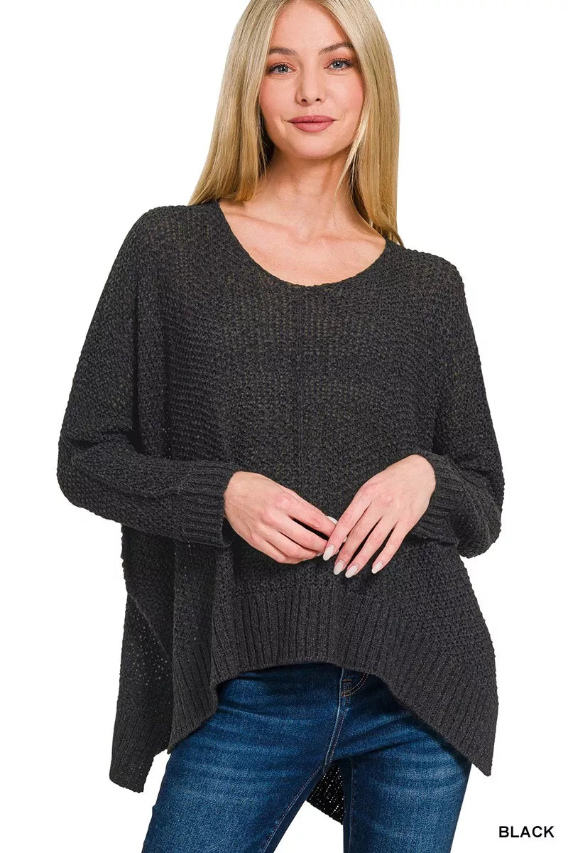 Black dolman-sleeve V-neck knit sweater with wide neckline and ribbed hem
