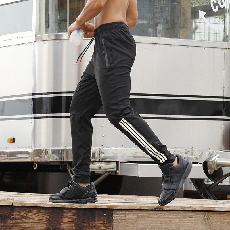 Men's black slim jogger pants with drawstring and white side stripe