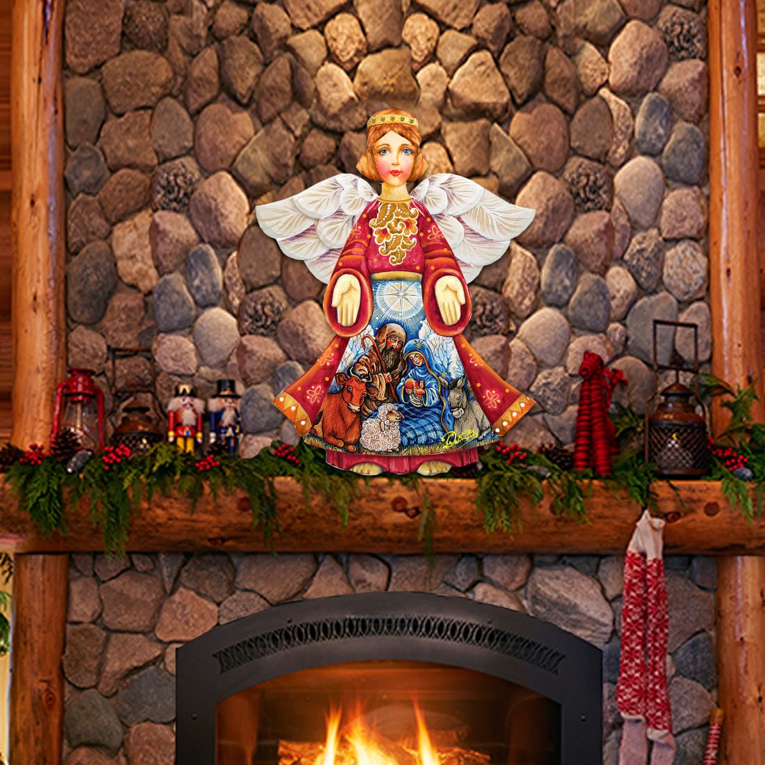 Nativity angel door decor: red robe, white wings, rings over nativity scene