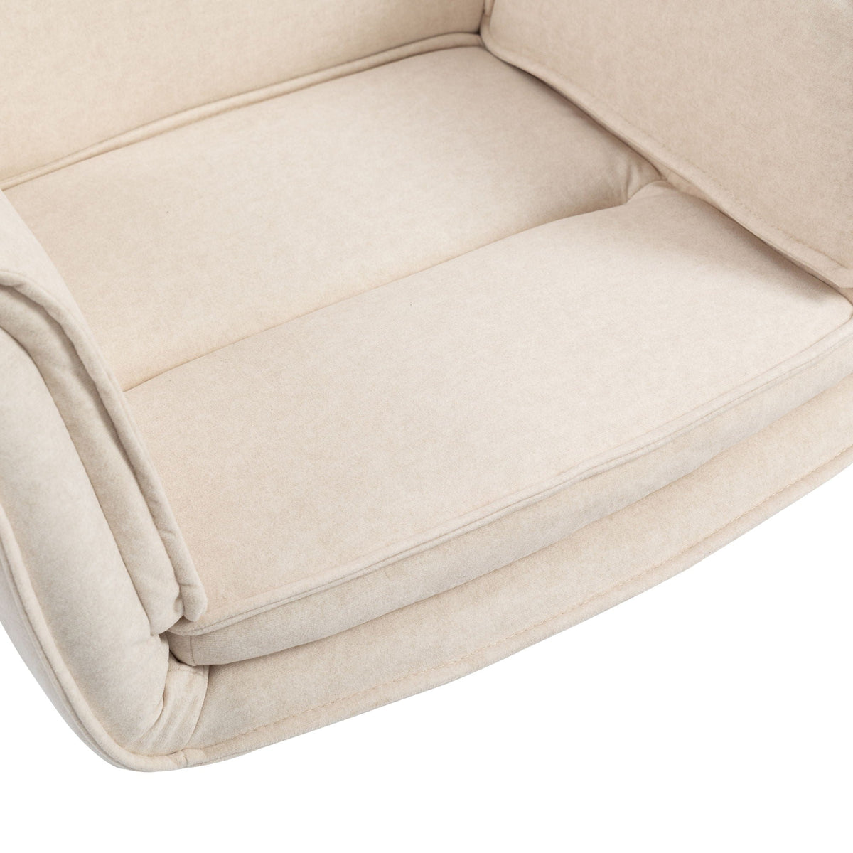 Beige upholstered chair seat cushion with stitched seams and padded armrest edge.
