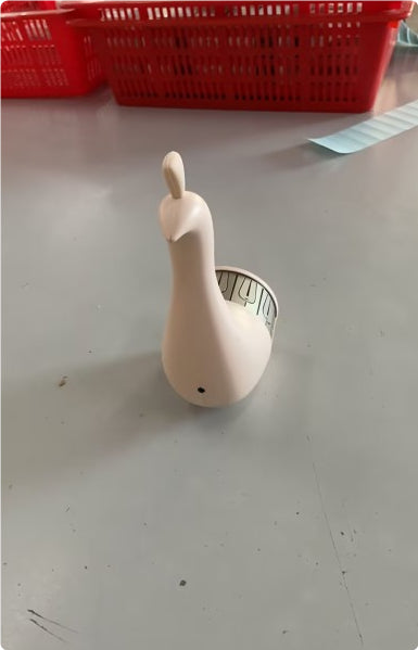 White peacock wall lamp with curved body and outlet panel detail