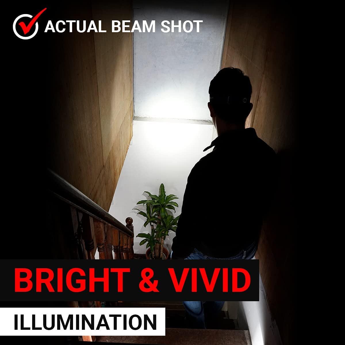 Hands-free LED headlamp shining a bright beam in a dark indoor setting