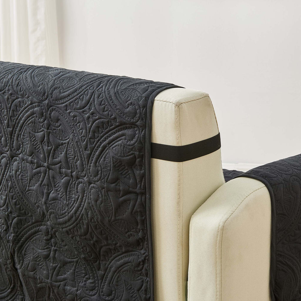 Dark gray and light tan armchair protector with quilted medallion pattern