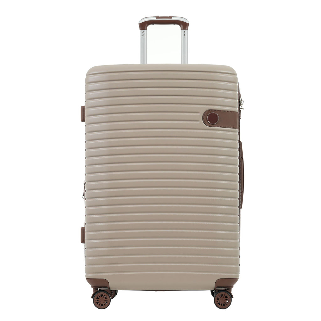 Beige hard-shell upright suitcase with brown trim, telescoping handle, and corner wheels.