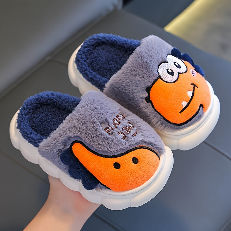 Girls' dinosaur slippers, close-up pair in grey with orange and dark blue dino faces