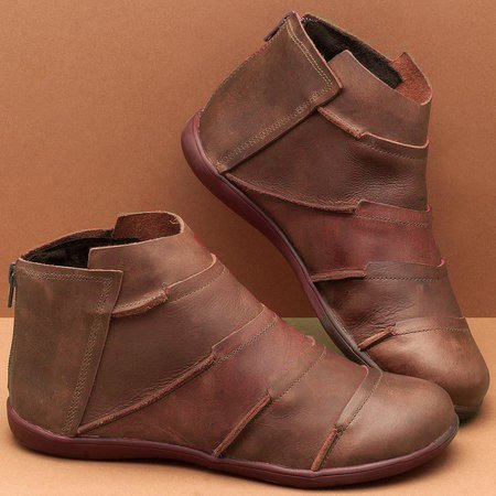 Brown short ankle boots with side pull tab and layered seam details
