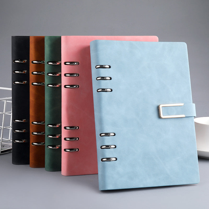 A5 light blue loose-leaf notebook with metal rings and buckle closure