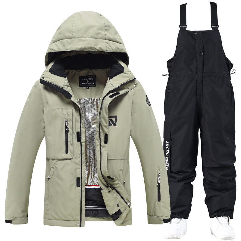 Beige jacket with hood and black bib ski pants with adjustable straps