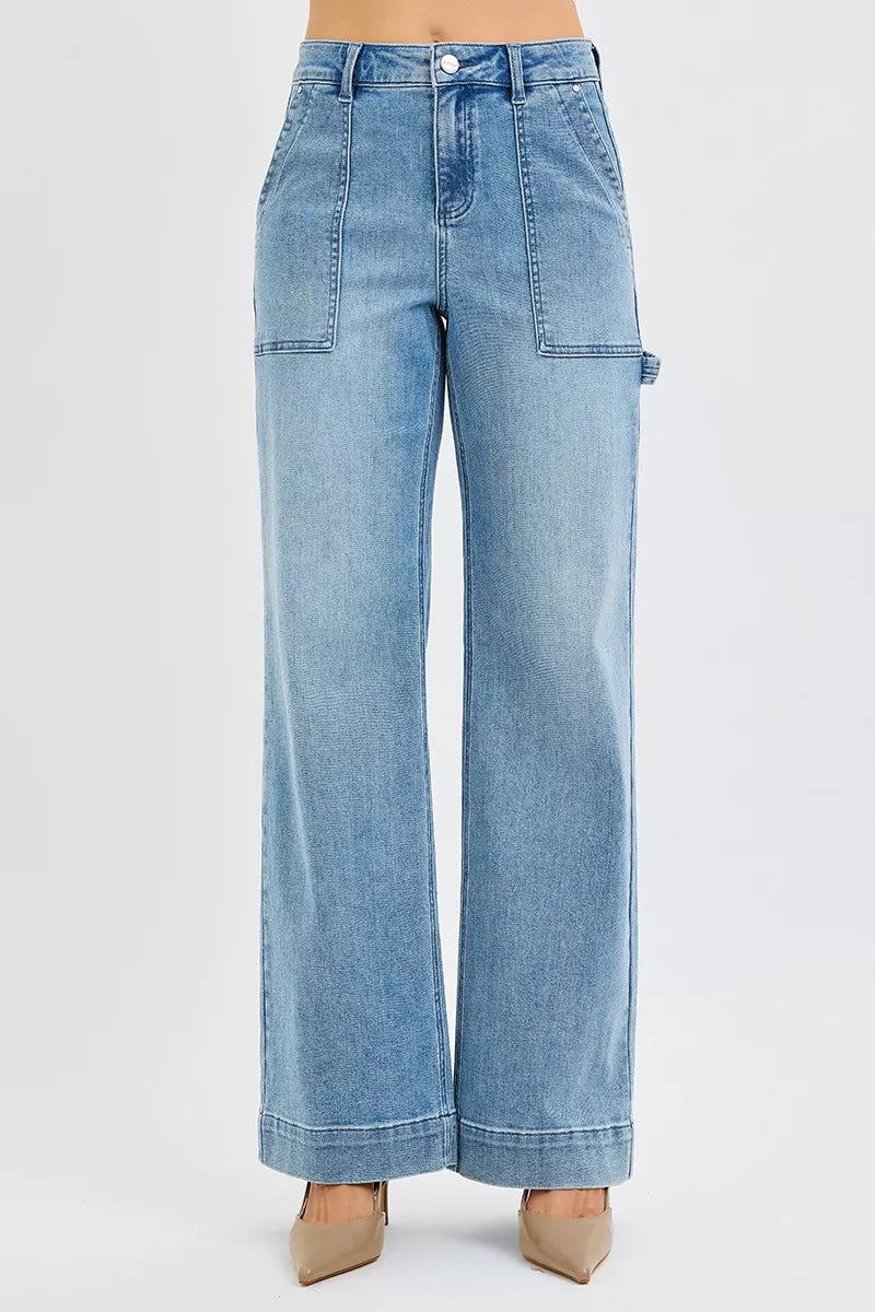 Medium wash high-rise straight-leg jeans with front pockets and stitched seams