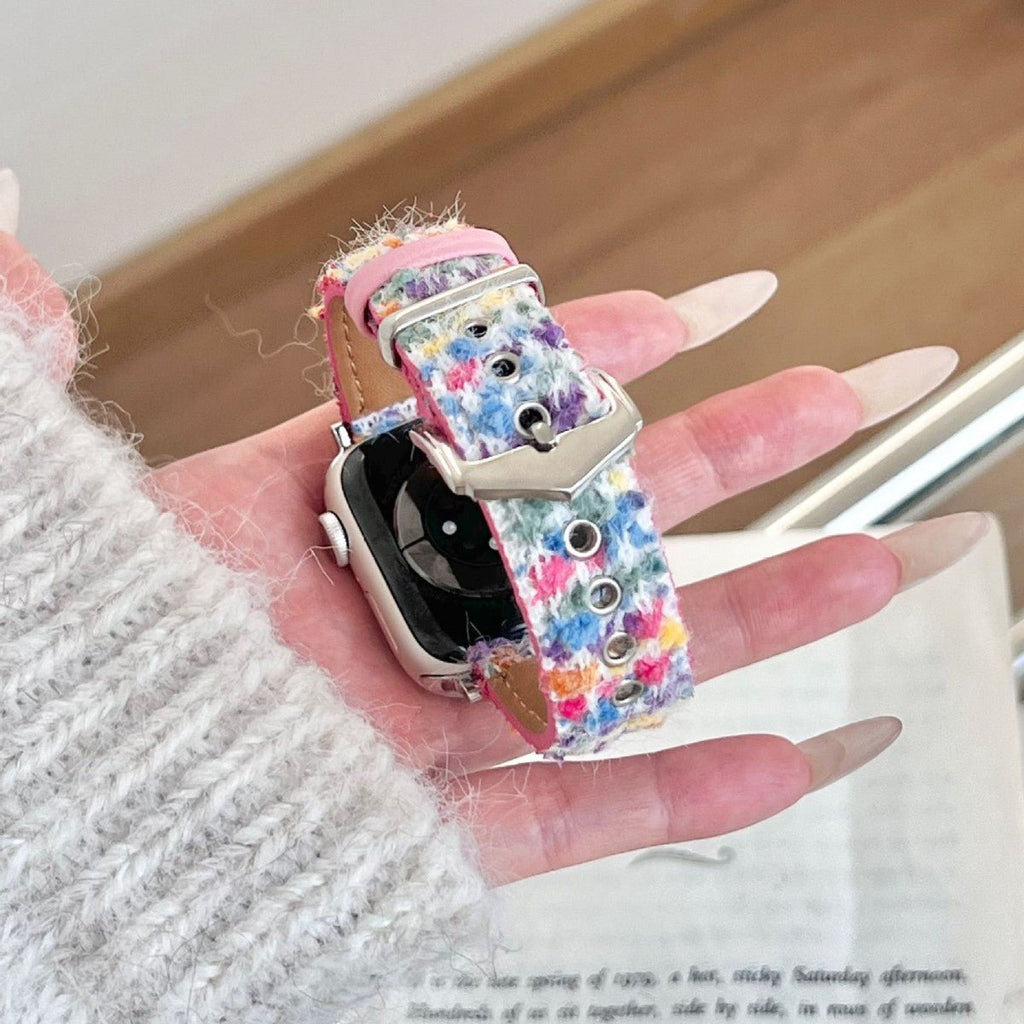 Christmas watch strap with light blue, pink, and multicolor fuzzy fabric and metal buckle
