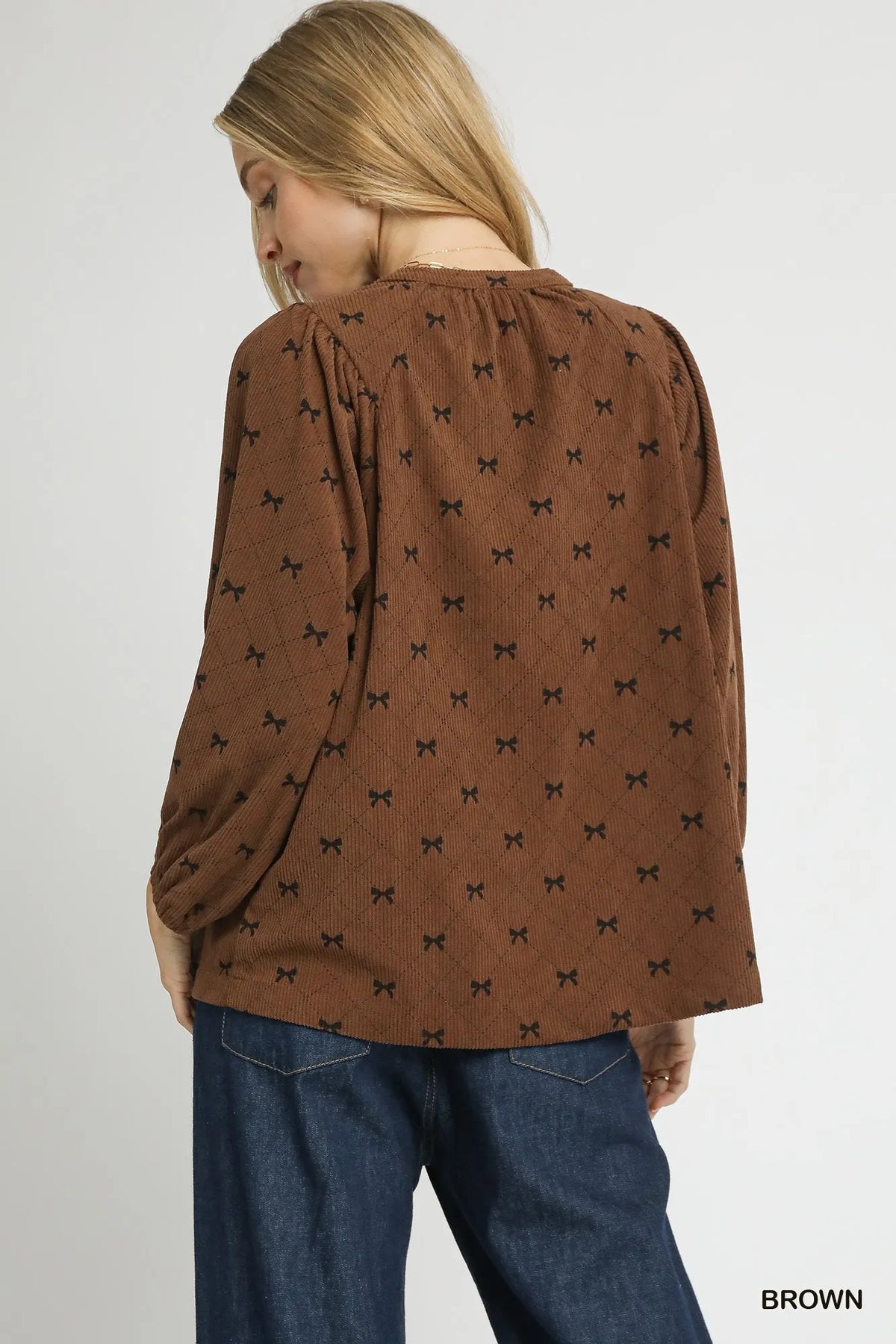 Brown corduroy bow-print blouse back view with balloon sleeves and gathered yoke