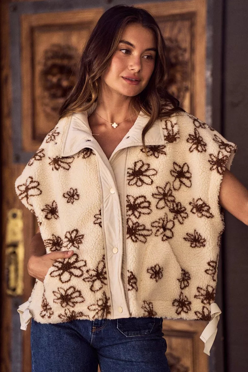 Oversized sleeveless sherpa vest jacket, cream with dark brown floral embroidery, open collar