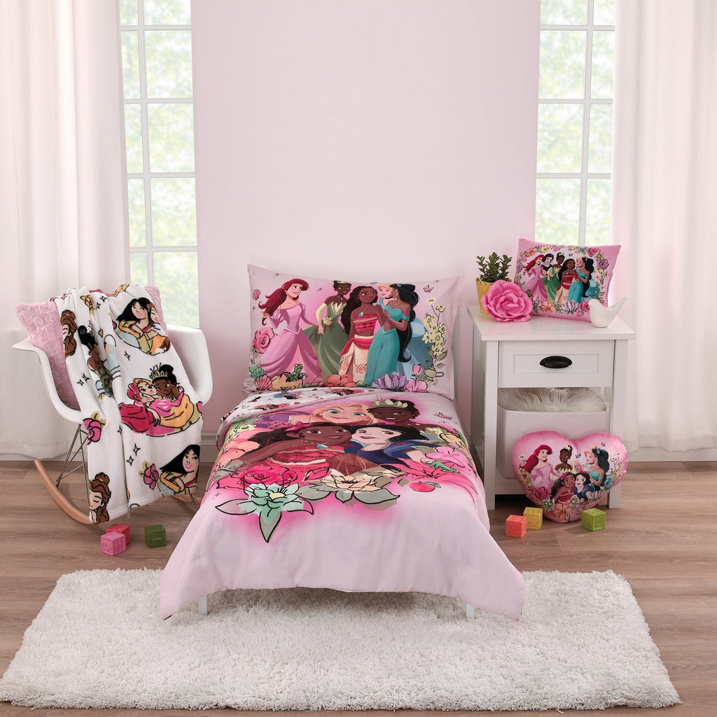 Princess graphic toddler pillow on bed, pink floral-detailed design
