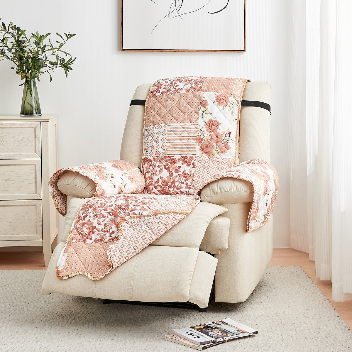 Reversible armchair protector on beige recliner with peach floral quilted covering