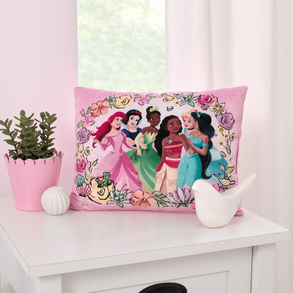 Pink princess-themed toddler pillow with floral frame and character illustration