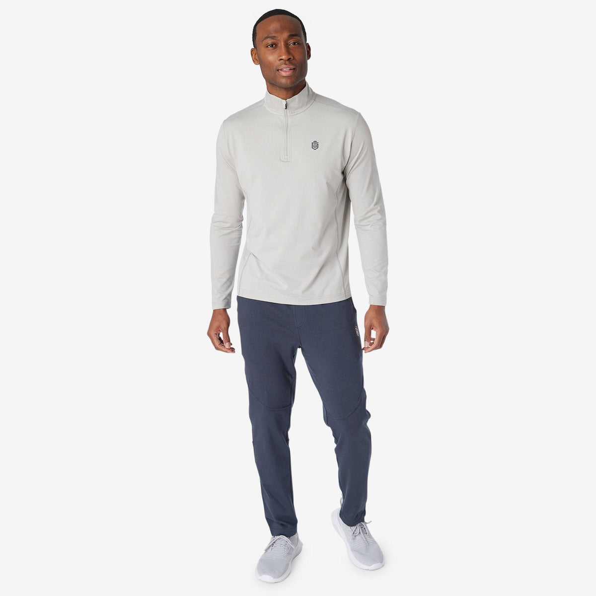 Navy jogger pants with elastic waistband and tapered legs.