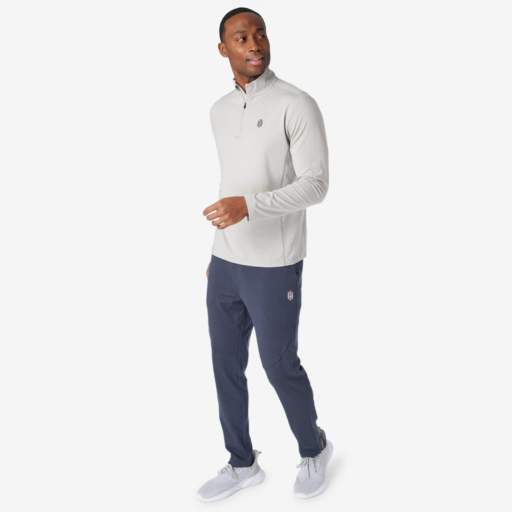 Navy jogger pants with tapered legs and elastic waistband.