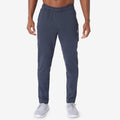 Navy jogger pants with drawstring waist, side pockets, and tapered fit.