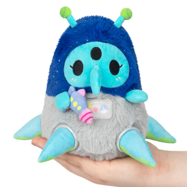 Plush plague doctor alien plush with blue hood, gray wings, green antennae, pink scarf