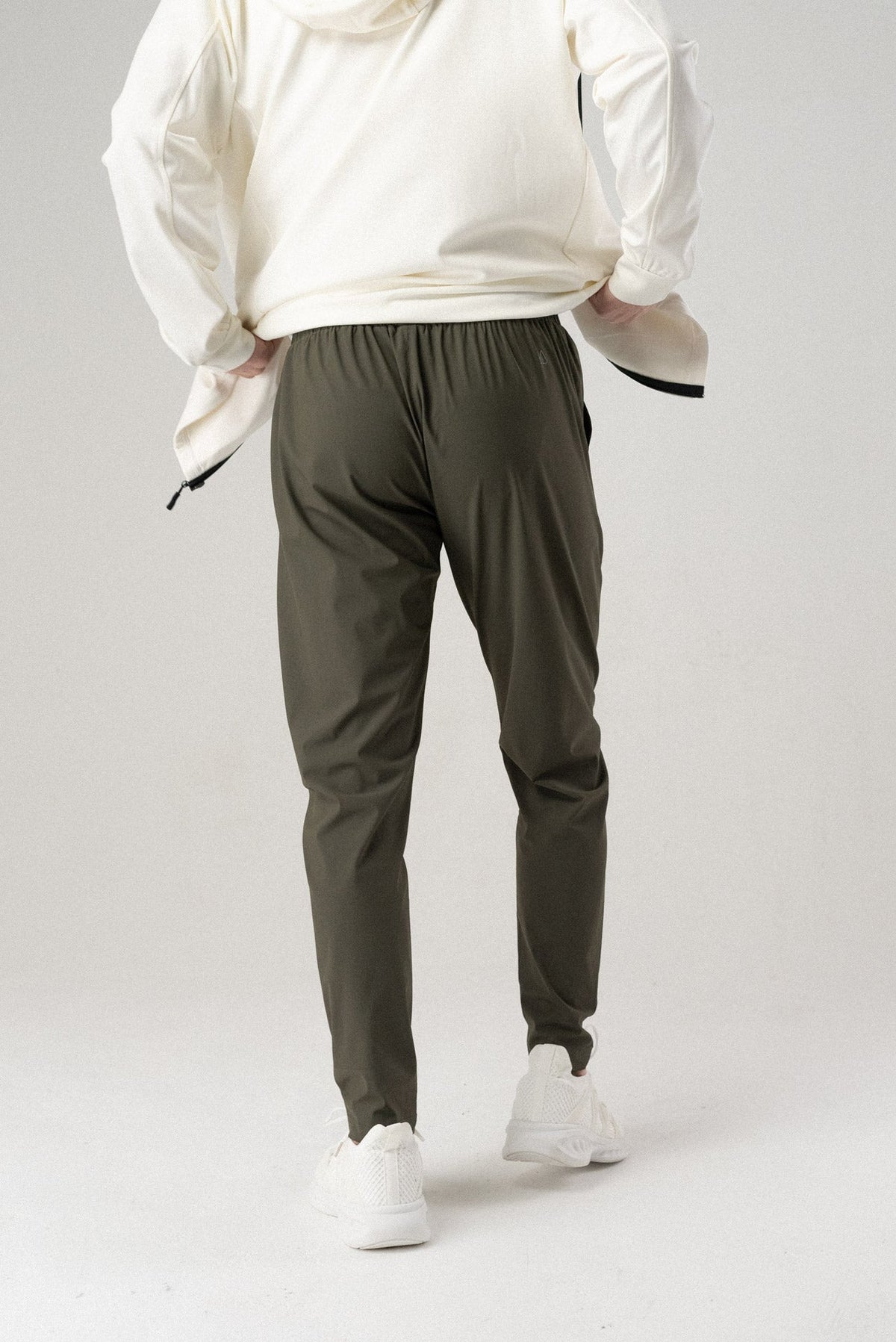 Olive jogger-style pants with elastic waist, tapered legs, and side pockets