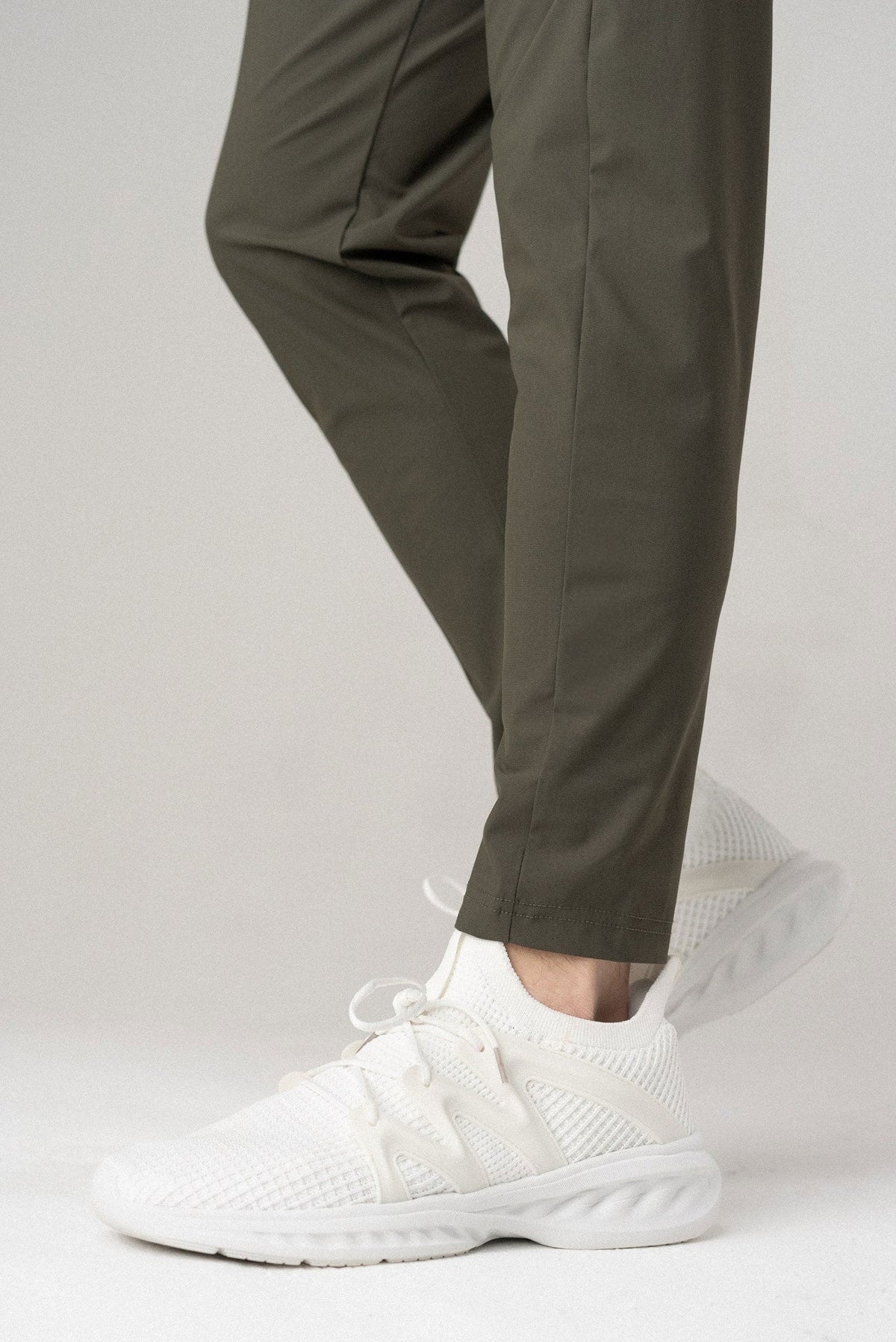 Dark olive jogger-style pants with tapered fit and elastic ankle cuffs