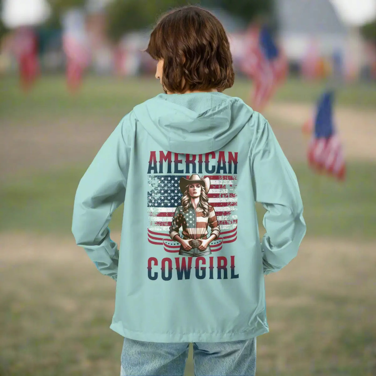 Aqua lightweight windbreaker jacket with hood and back 'American Cowgirl' print