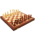 Wooden chess and checkers board with cream side and dark side pieces, angled view