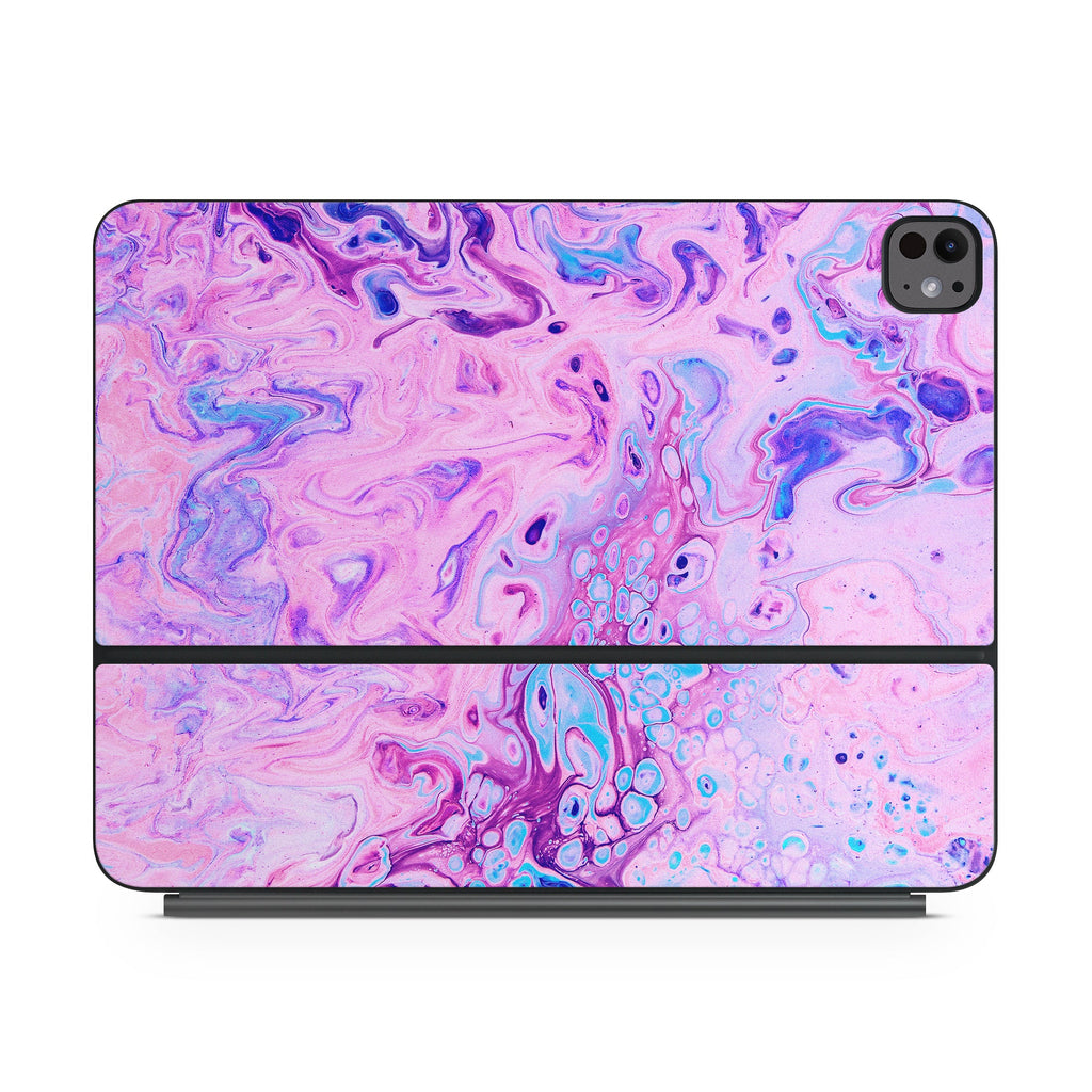 Apple Magic Keyboard iPad skin with bubble-bath purple and pink swirls, front view